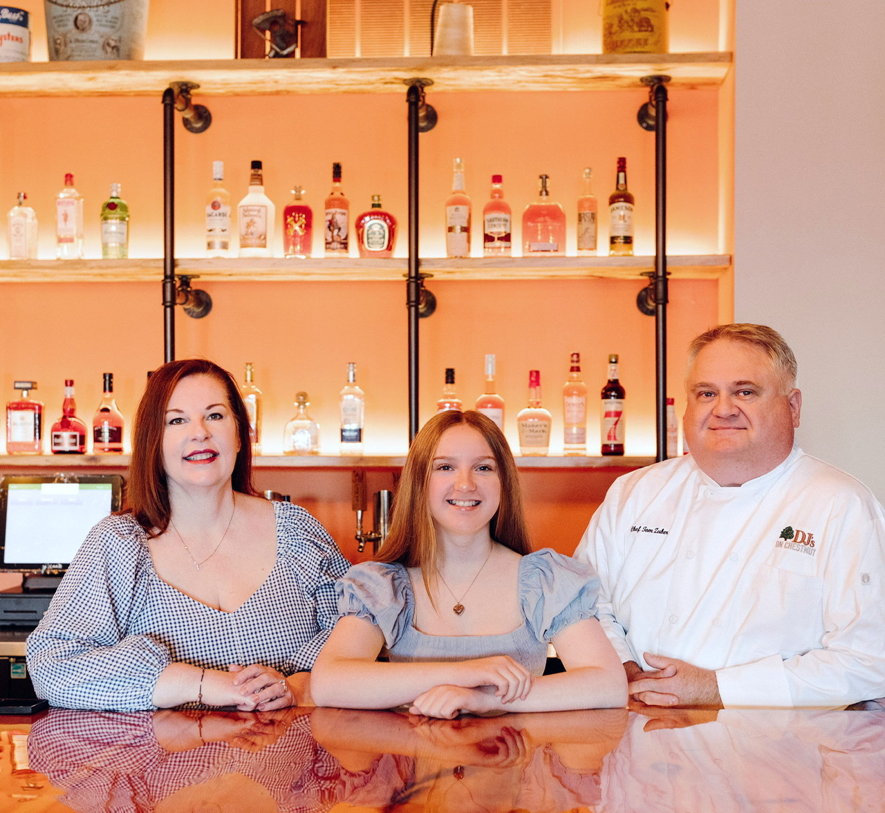 Zuber family behind the bar